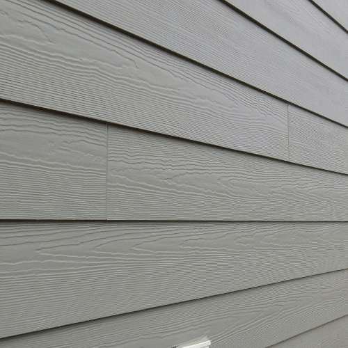 Picture of close up of gray siding on the side of a house