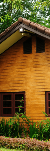 Picture of light cedar wood colored siding on a house with brown trim windows